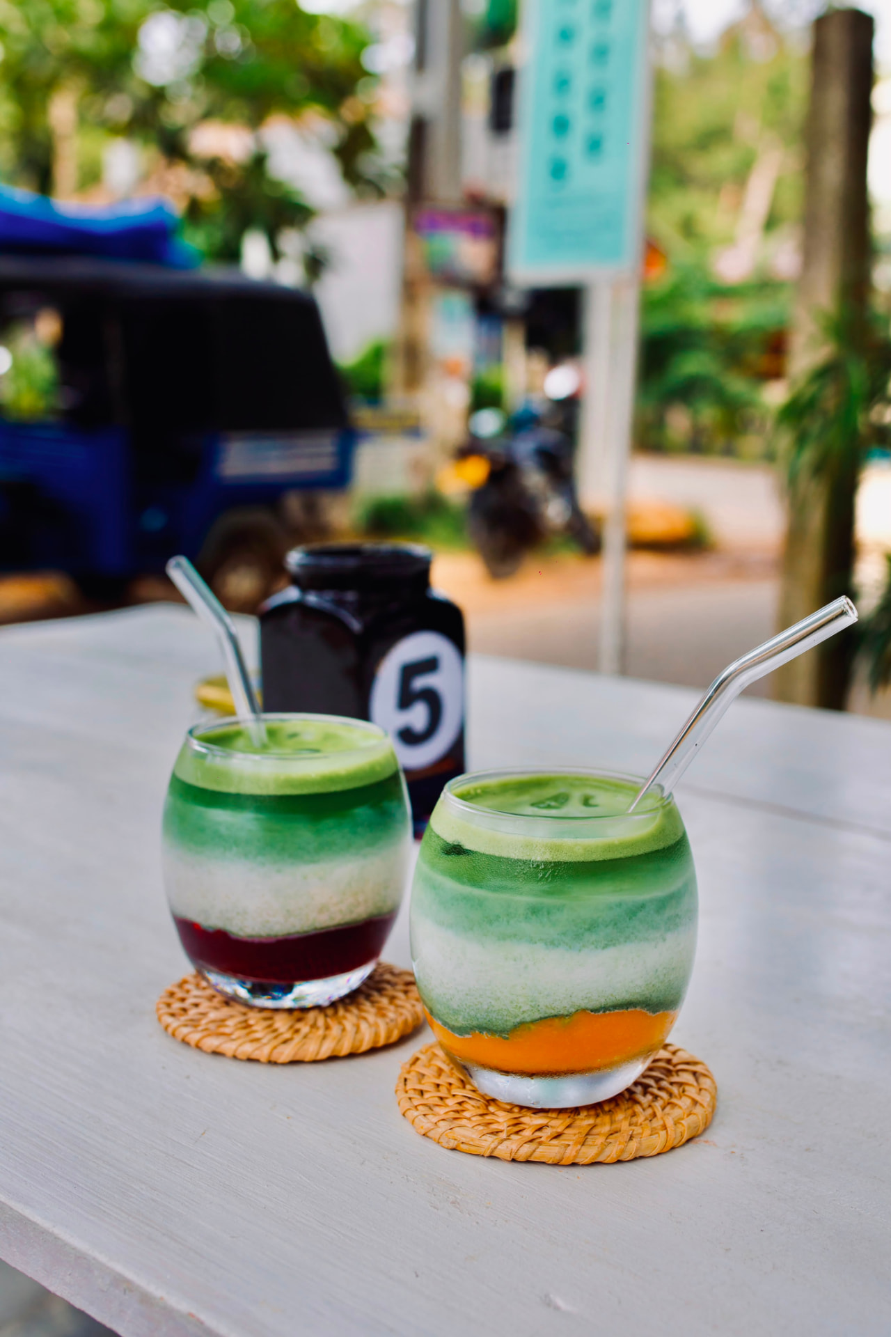 Layered green smoothies in glasses